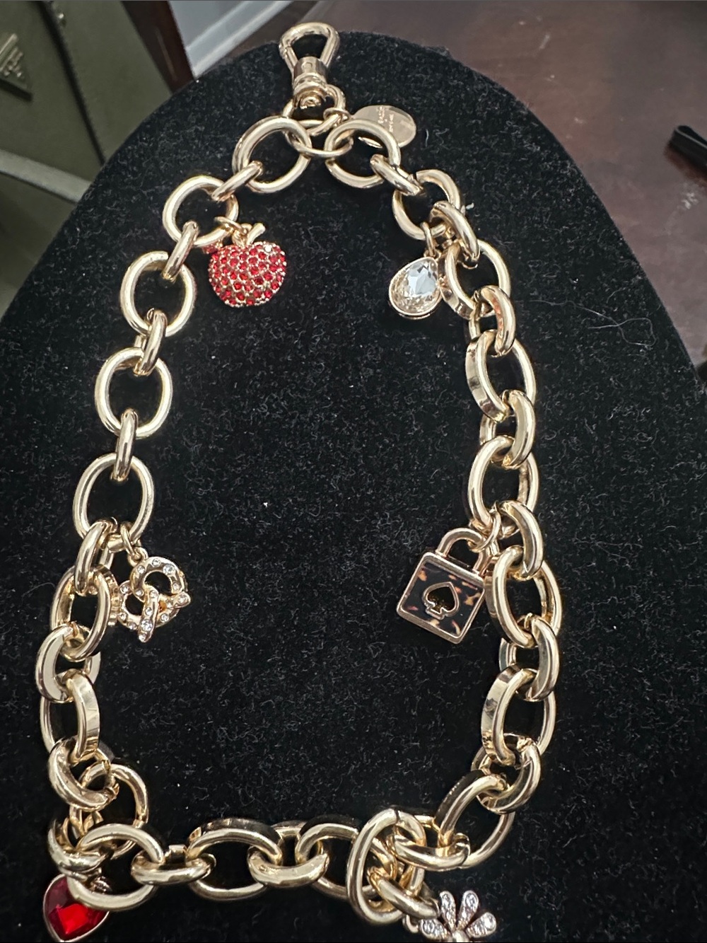 kate spade Gold Tone phone charm with Red Apple Accent